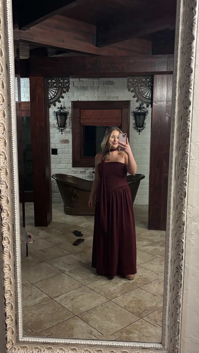Client in a burgundy gown