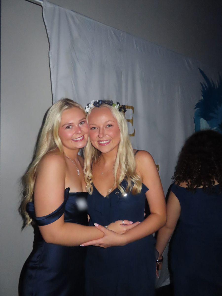 Two friends in navy dresses