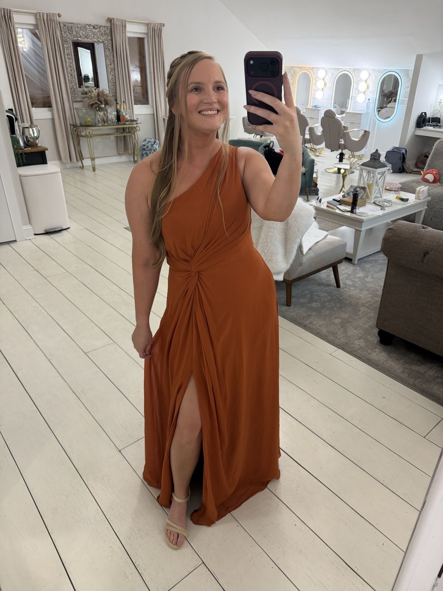 Client in a rust gown