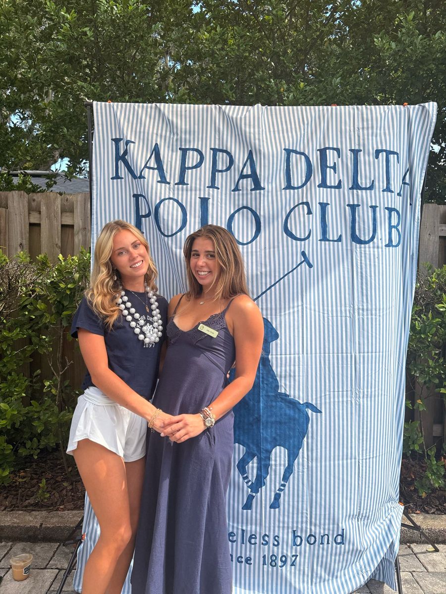 Two friends at a polo party
