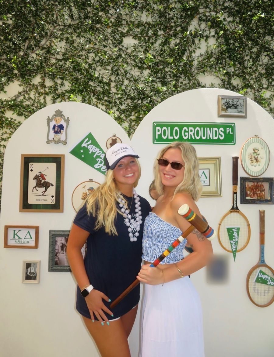 Two friends at a polo party