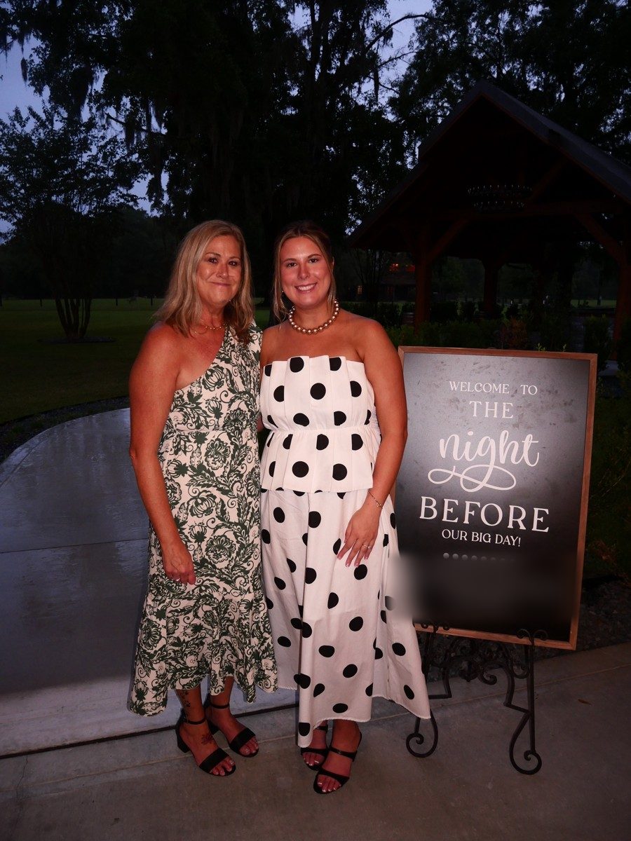 Client and a guest at a rehearsal dinner