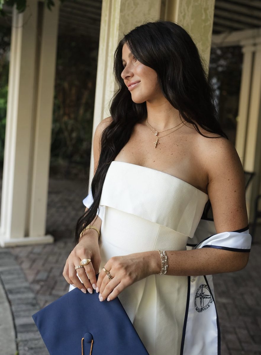 Graduate in a white dress