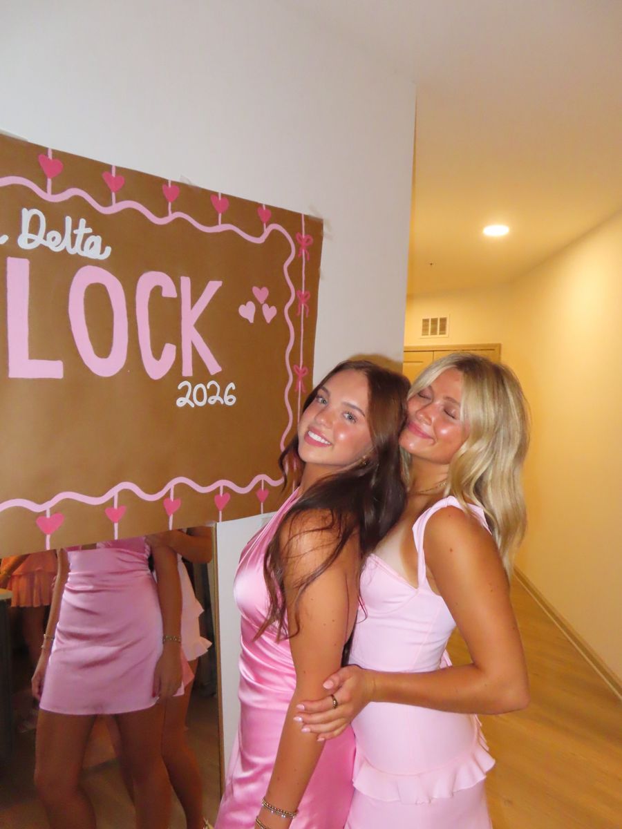 Two friends in pink dresses